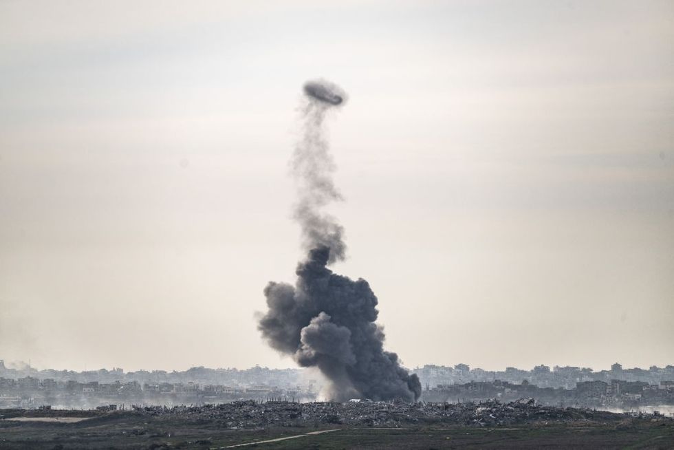 \u200b Smoke, rising over the destroyed and heavily damaged residential areas