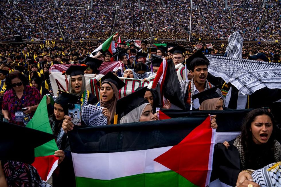 \u200b Students demonstate during a Pro-Palestinian protest during the University of Michigan's spring commencement ceremony