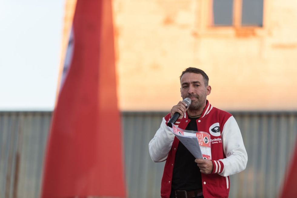 \u200b Sven Liebich seen speaking during a protest against Merkel's visit to Chemnitz, Deutschland