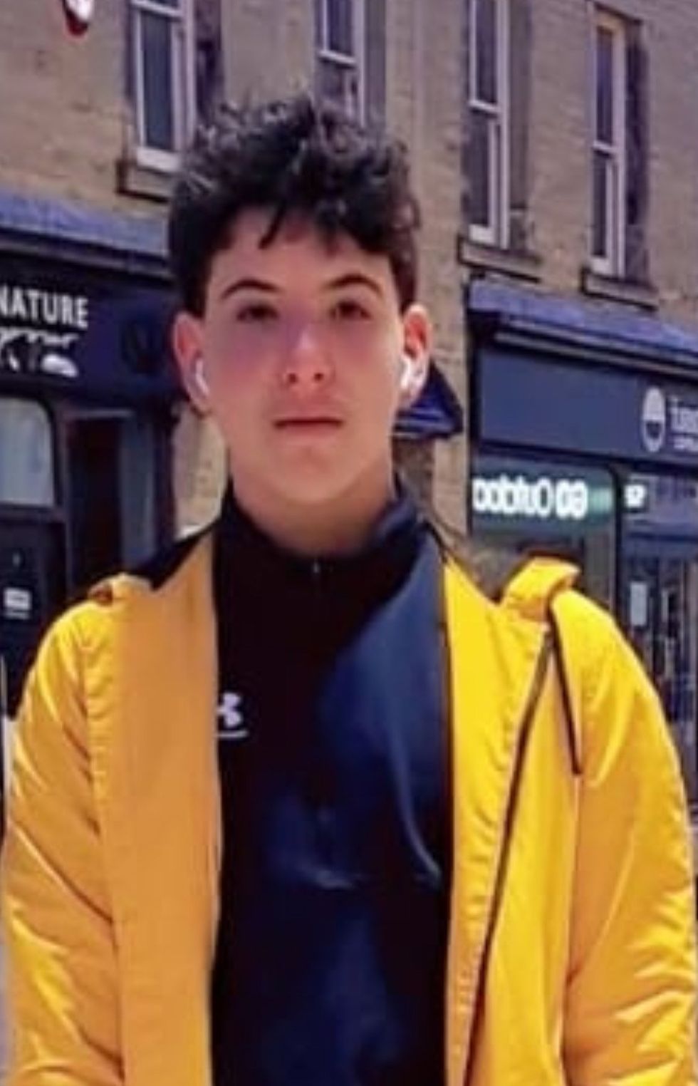 \u200b the 16-year-old Syrian refugee after he brushed past his girlfriend in Huddersfield town centre.