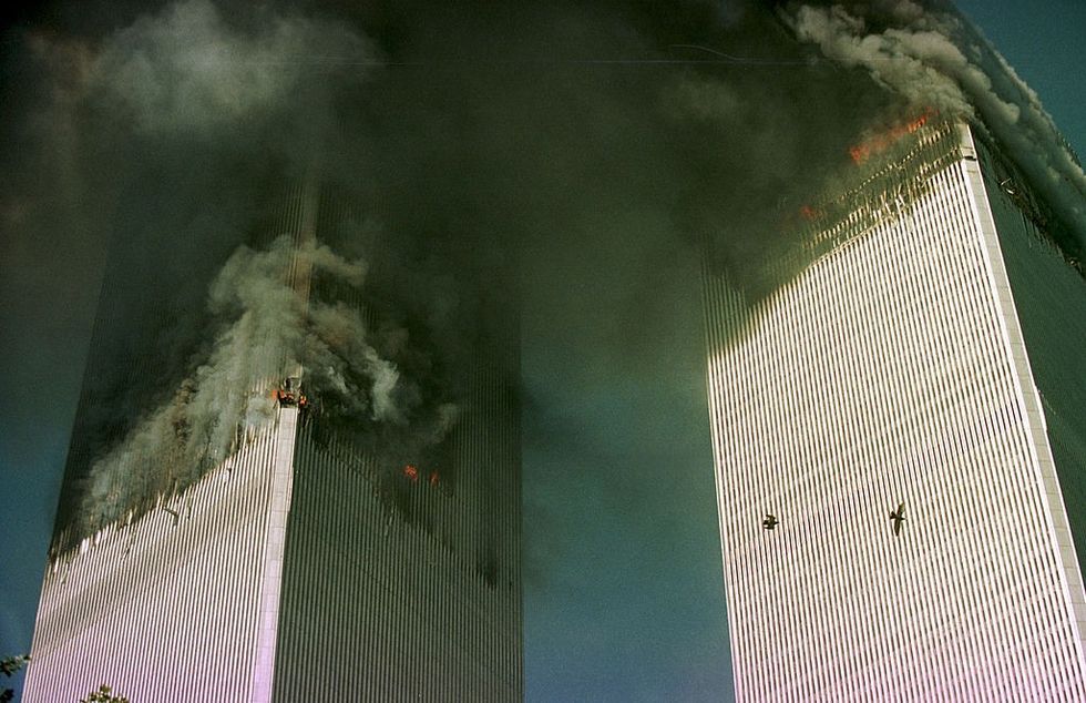 \u200b The World Trade Center is engulfed in flames just before the south tower collapsed September 11, 2001 in New York City