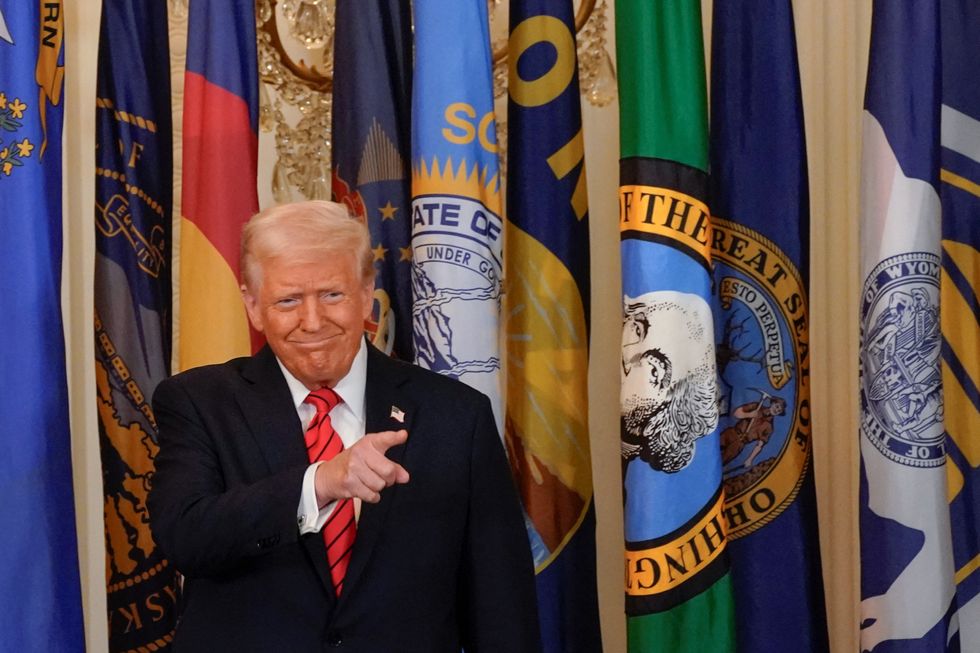 \u200b Trump gestures during an event to sign an executive order to shut down the Department of Education