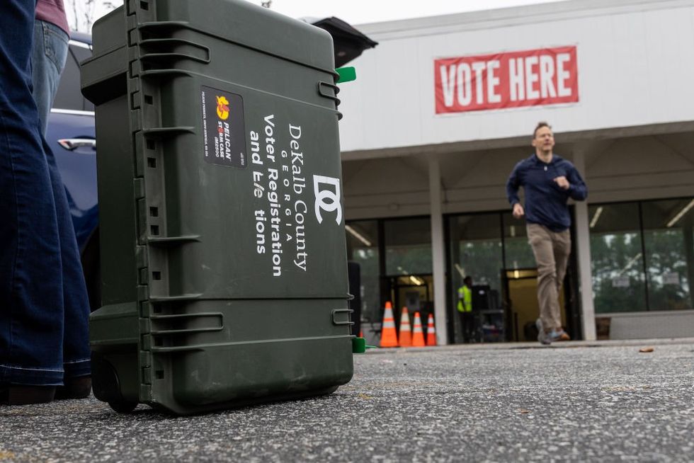 \u200b\u200bPrecinct supervisors collect election materials from the DeKalb County Voter Registration and Elections office on November 03, 2024