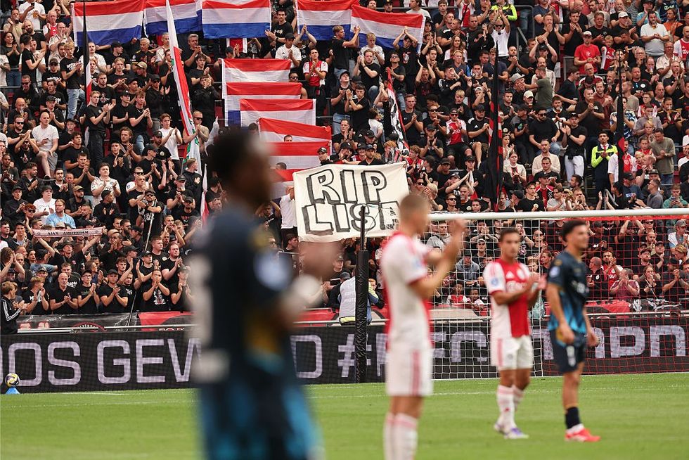 u200bA banner reading 'RIP LISA' is held up at an Ajax football match