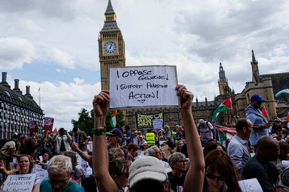 \u200bA demonstrator holds a placard