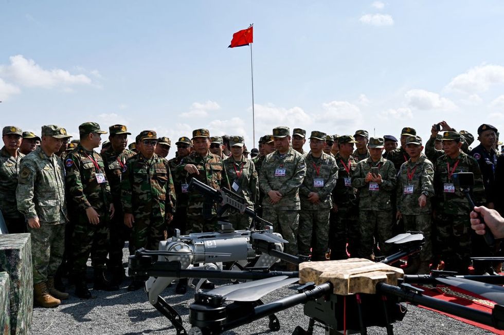 \u200bA dog with a machine gun strapped to its head