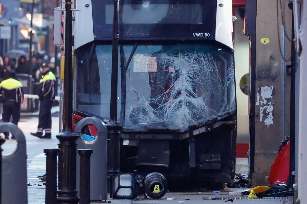 \u200bA double-decker bus sits on the side of the road in Dublin city centre