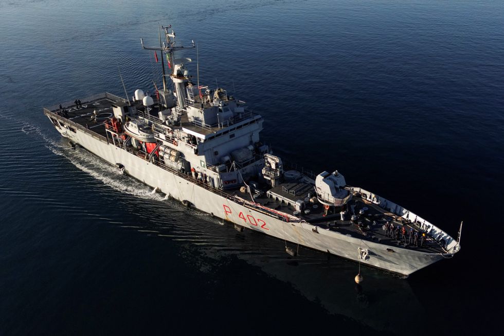 \u200bA drone view of Italian navy ship Libra carrying migrants arriving in Albania, as part of a deal with Italy to process thousands of asylum-seekers caught near Italian waters