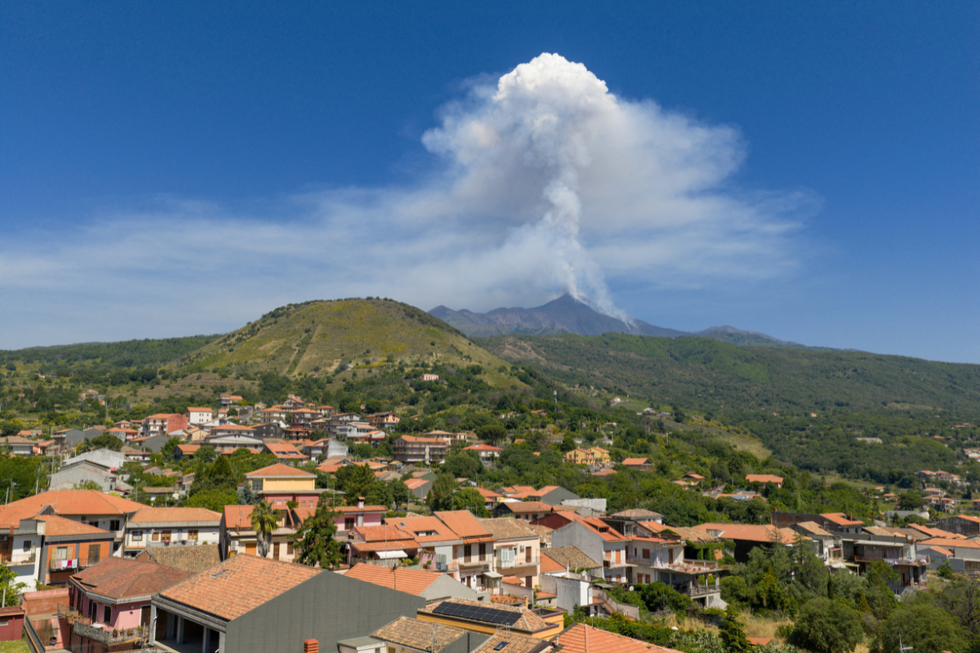 \u200bA drone view shows volcanic steam rising from Mount Etna, as seen from Milo