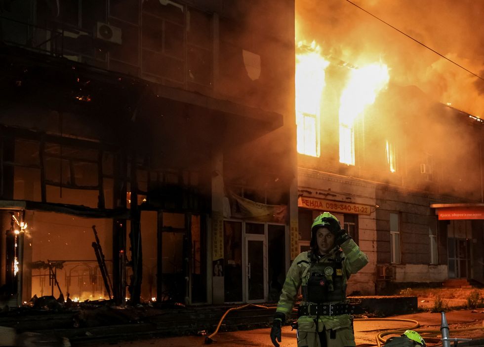 \u200bA firefighter works at the site of a Russian drone attack, amid Russia's attack on Ukraine in Kyiv