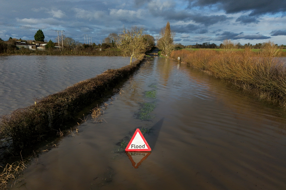 \u200bA flooded Eckington Road in Defford, Worcestershire
