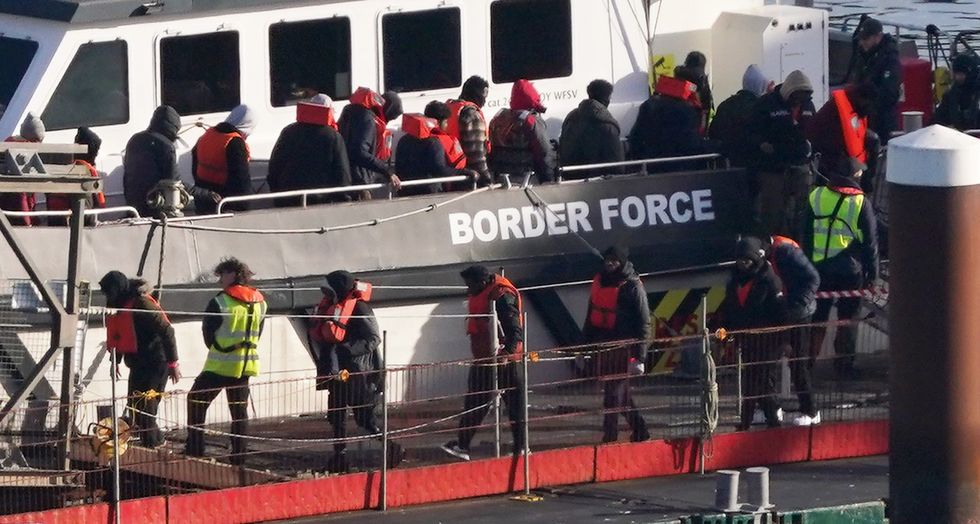 \u200bA group of people thought to be migrants are brought in to Dover, Kent, from a Border Force vessel