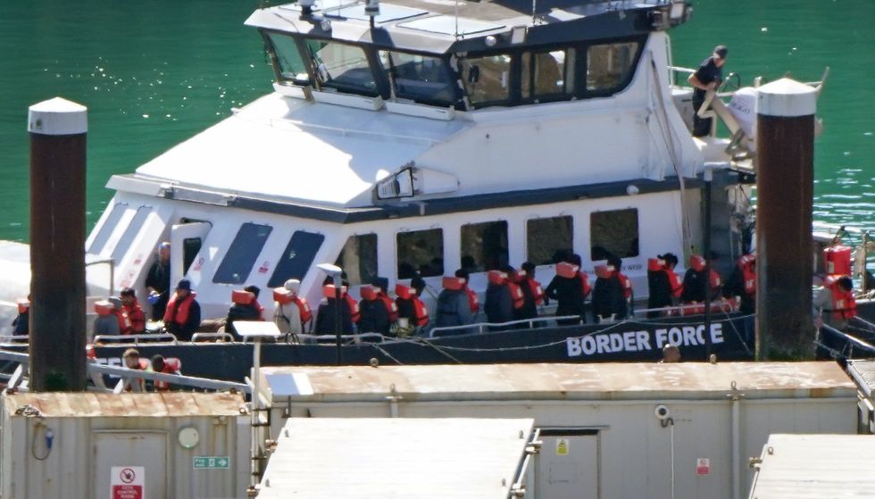 \u200bA group of people thought to be migrants are taken to Border Security Command in Dover, Kent on Friday