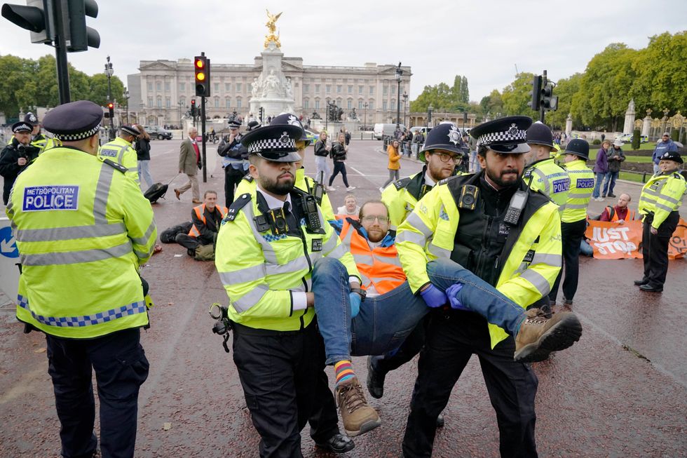 \u200bA Just Stop Oil protester is taken away by police