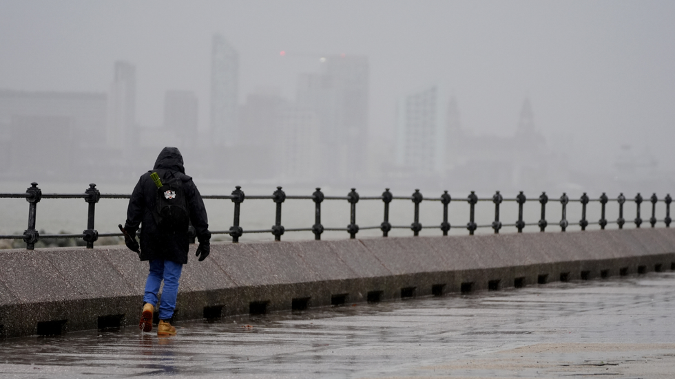 \u200bA man walks along The Promenade New Brighton in Liverpool, ahead of Storm Darragh