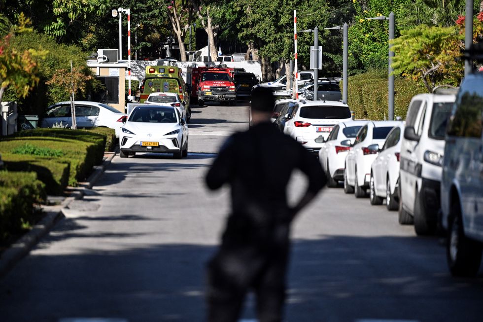 \u200bA member of Israeli security personnel stands at the entrance to a street, following a drone attack from Lebanon towards Israel amid ongoing hostilities between Hezbollah and Israel, in Caesarea