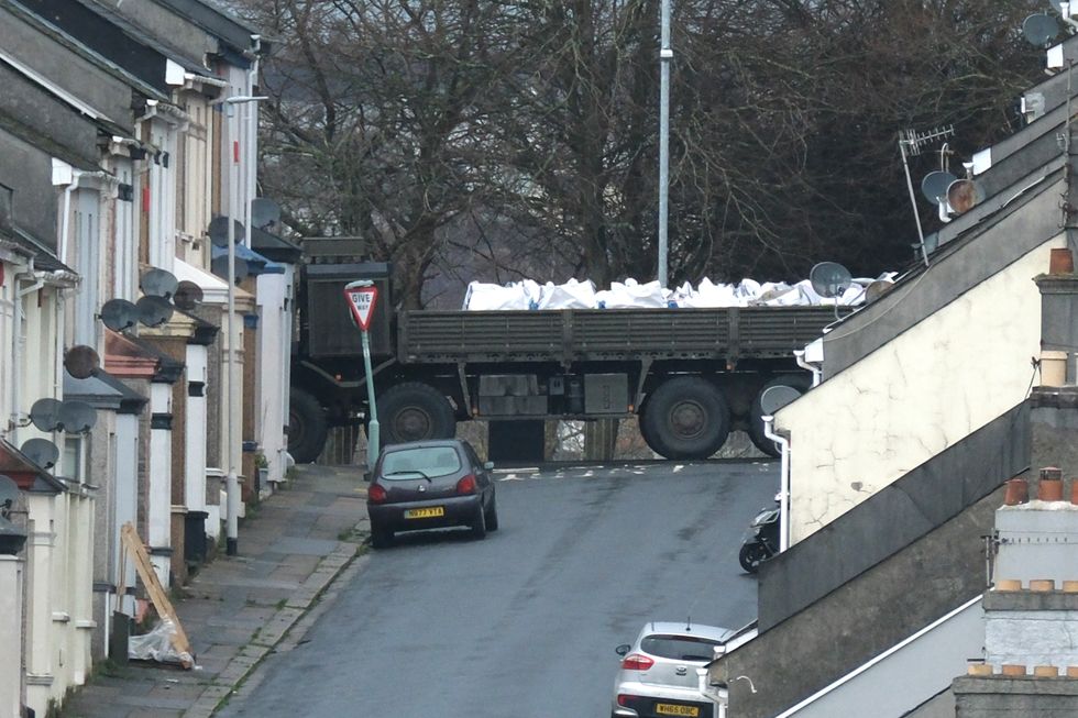 \u200bA military vehicle has been pictured transporting the unexploded bomb through deserted streets in Plymouth