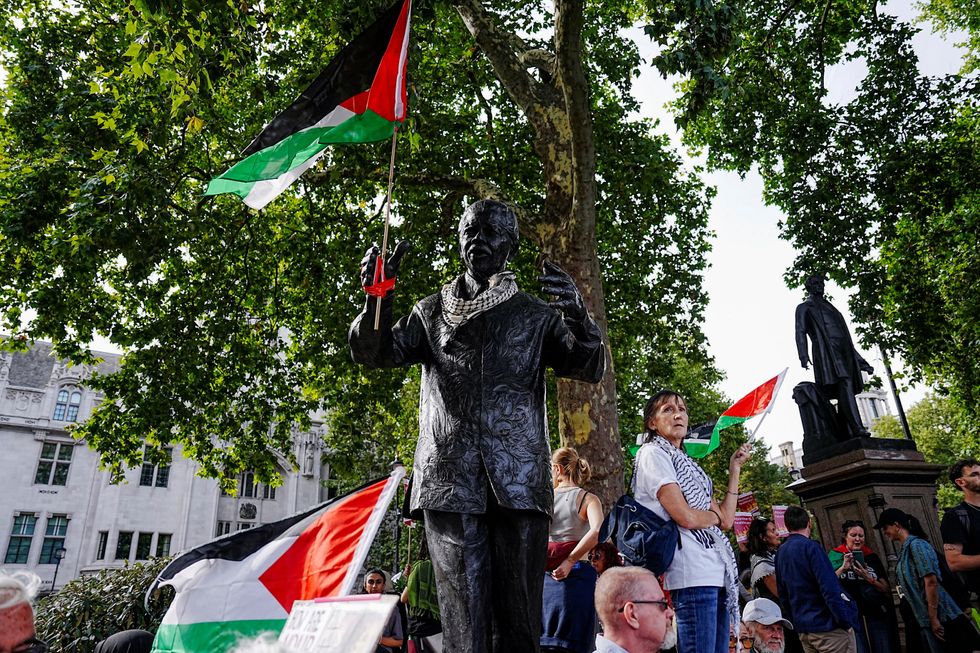 \u200bA Palestinian flag was attached to a monument in Parliament Square