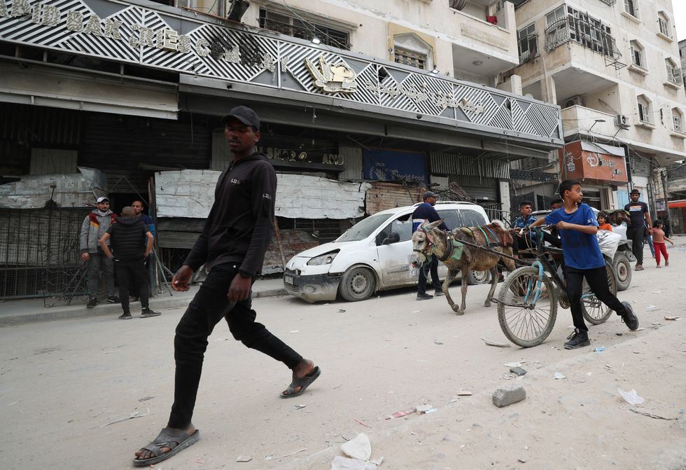\u200bA Palestinian man walks near a bakery that has stopped operating due to a lack of flour and fuel, in Gaza City