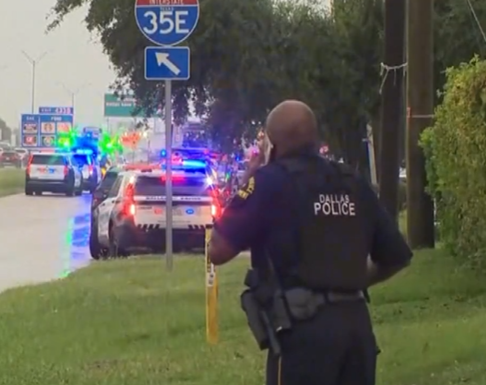 \u200bA police officer on the phone at the scene