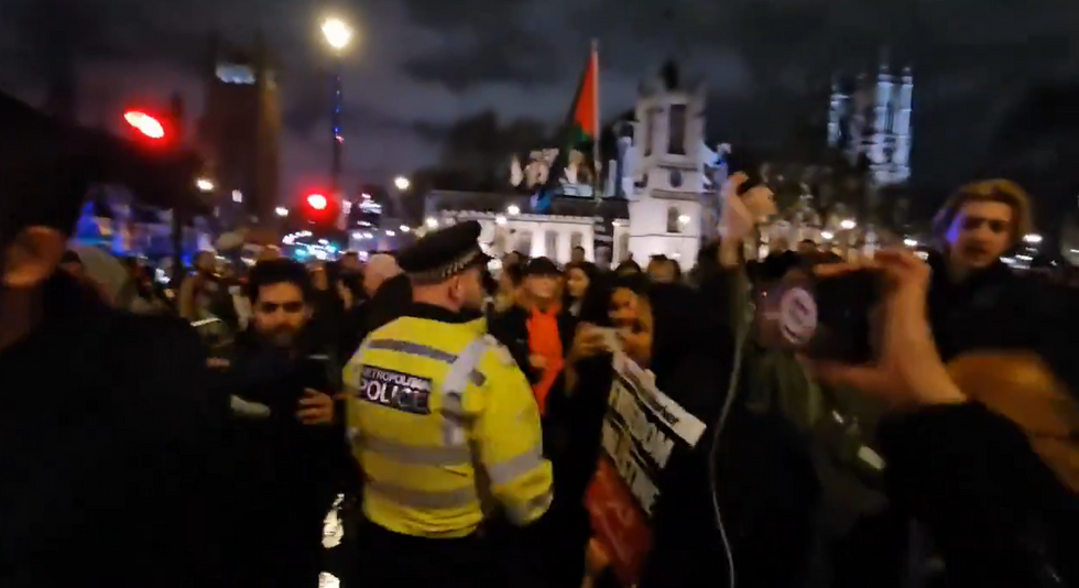 \u200bA police officer was spotted walking into the group of protesters but soon backed away