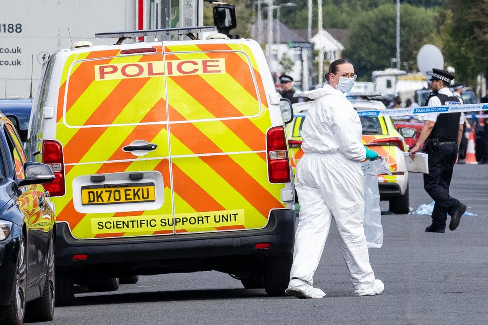 \u200bA police scenes-of-crime officer (SOCO) at the scene in Southport, Merseyside