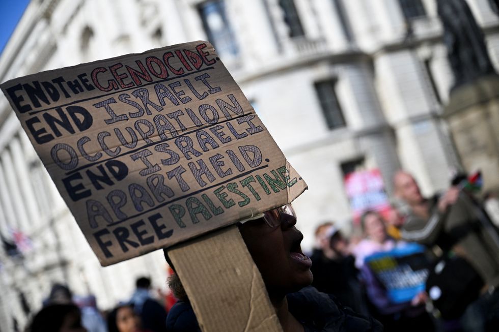 \u200bA protester holds a placard during a demonstration in support of Palestinians in Gaza, ahead of the October 7 attack anniversary