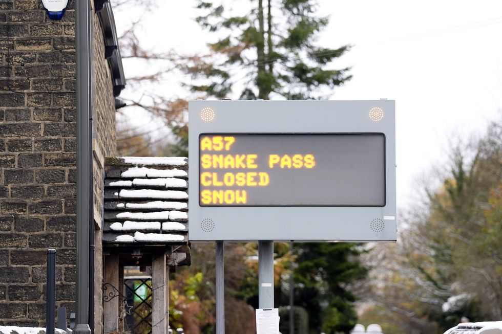 \u200bA sign in Glossop, Derbyshire, showing that the A57 snake pass is closed following heavy snowfall