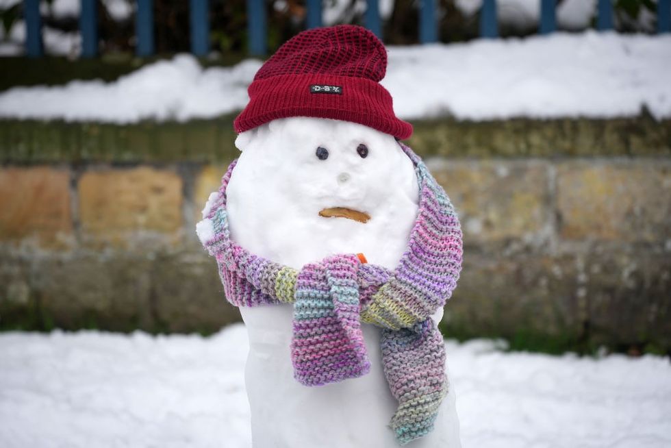 \u200bA snowman in the Derbyshire village of Edensor
