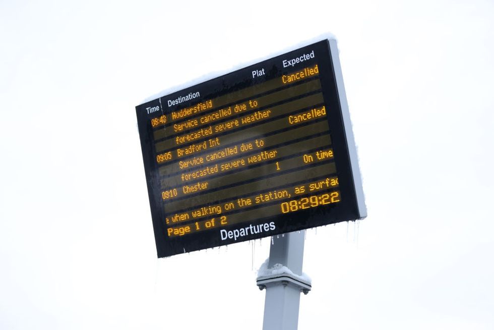 \u200bA train departure screen shows cancelations due to severe weather on November 19, 2024 in Bradford