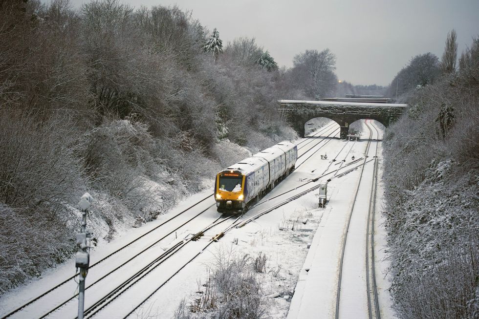 \u200bA train makes its way along the Hunt's Cross line in Liverpool