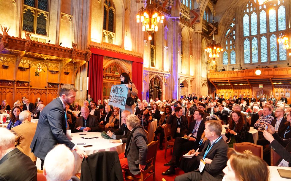 \u200bActivists from Climate Resistance protest during Conservative Party leader Kemi Badenoch's keynote speech