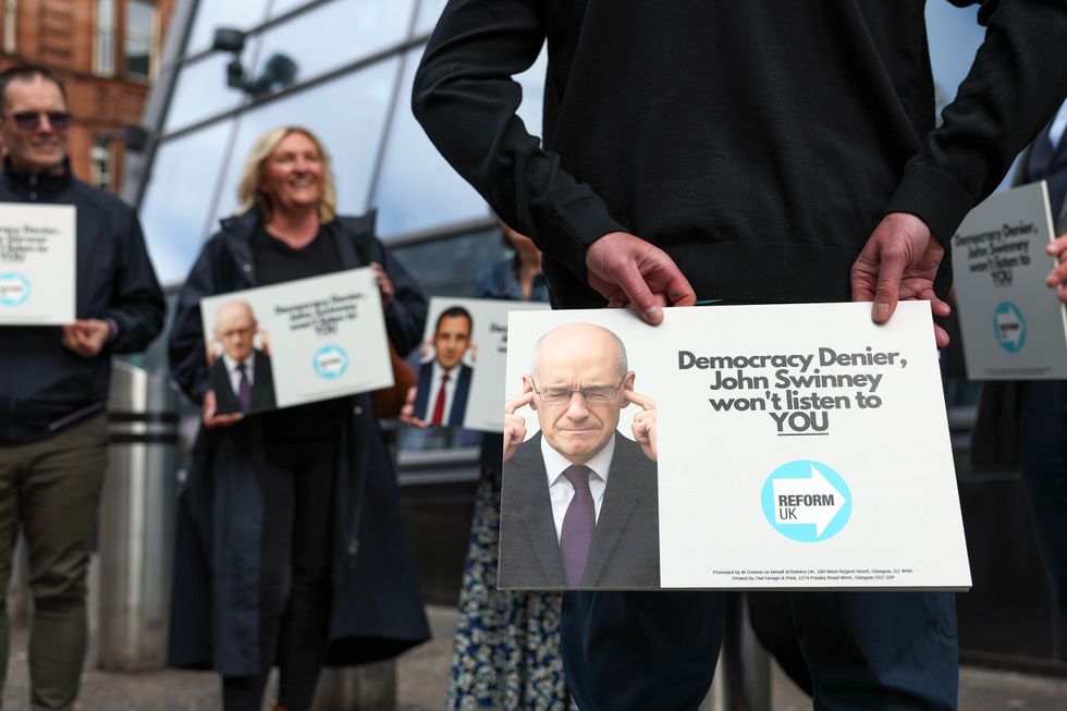 \u200bActivists from Reform UK at Merchants House of Glasgow, as First Minister John Swinney convenes a gathering