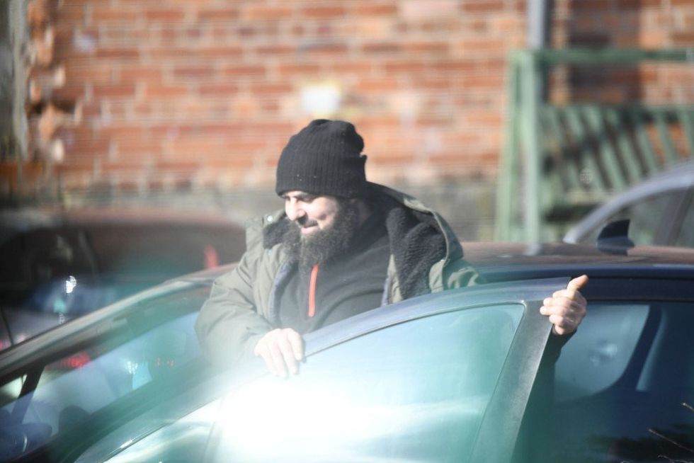 \u200bAmar Hussein getting into a car for a meeting with Walid Saadaoui