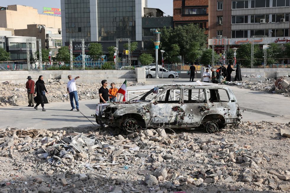 \u200bAn ambulance burned by Israeli attacks stands on a street, amid the Iran-Israel conflict, in Tehran, Iran