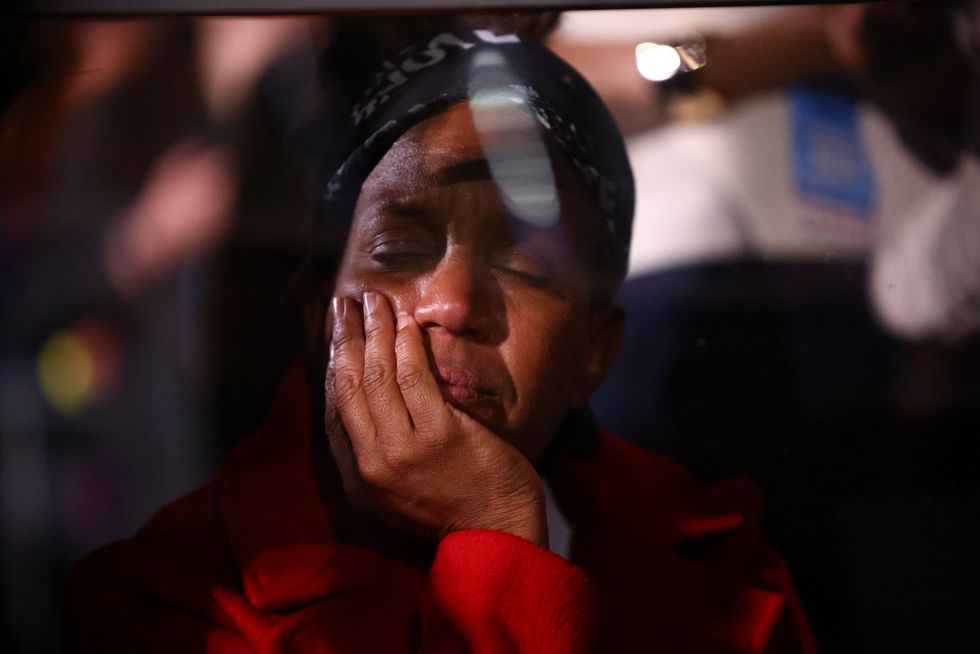 \u200bAn attendee reacts at the Election Night rally for Democratic presidential nominee US Vice President Kamala Harris