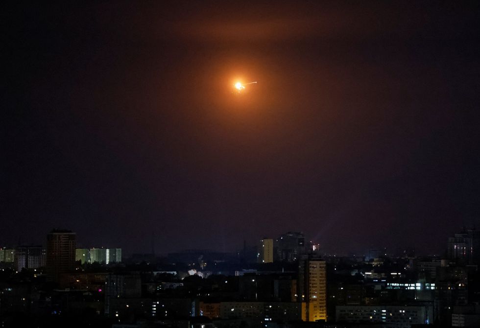 \u200bAn explosion of a drone is seen in the sky over the city during a Russian drone strike