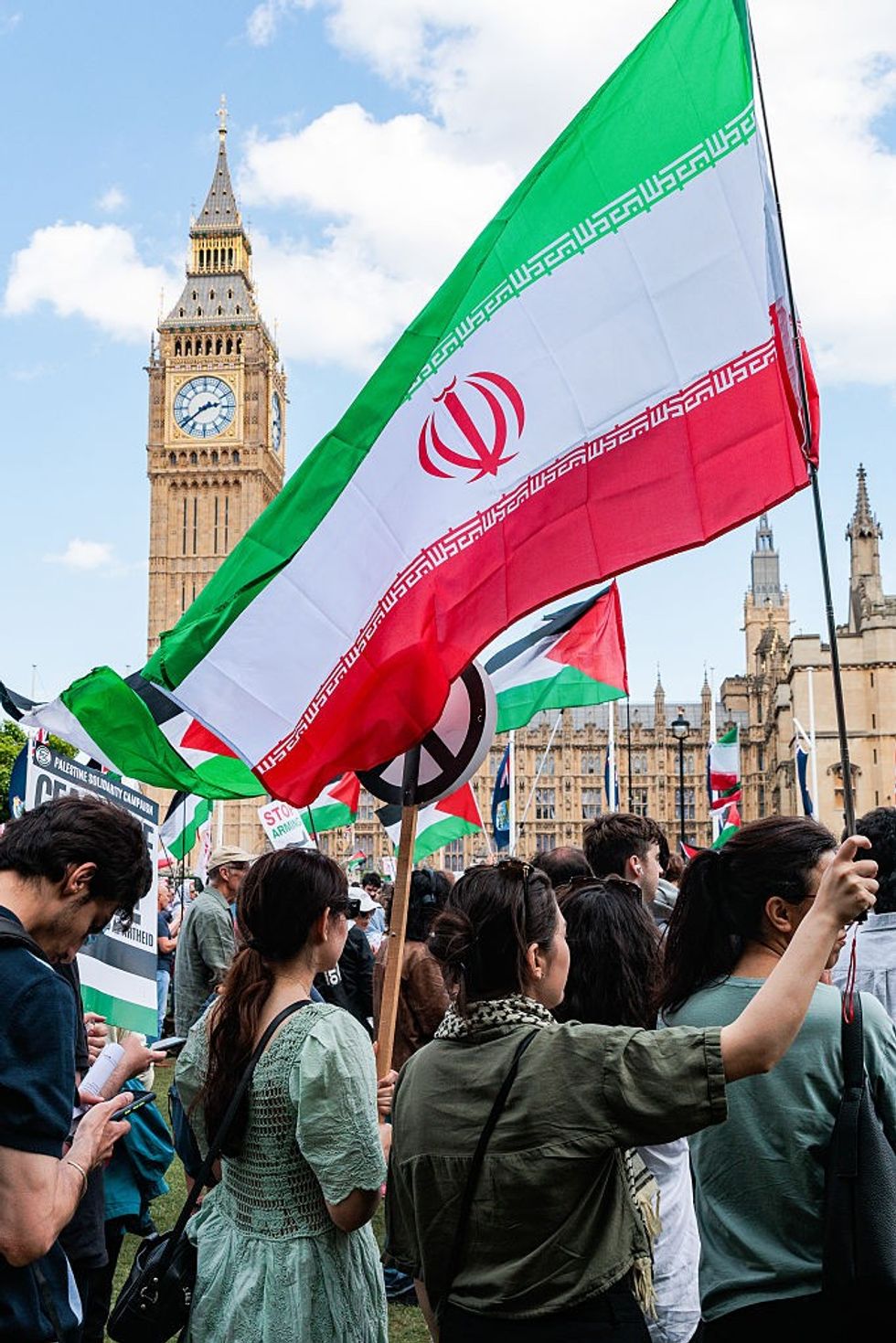 \u200bAn Iranian flag being waved at a pro-Palestine protest