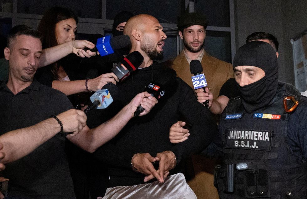 \u200bAndrew Tate and his brother Tristan are escorted outside the Directorate for Investigating Organized Crime and Terrorism