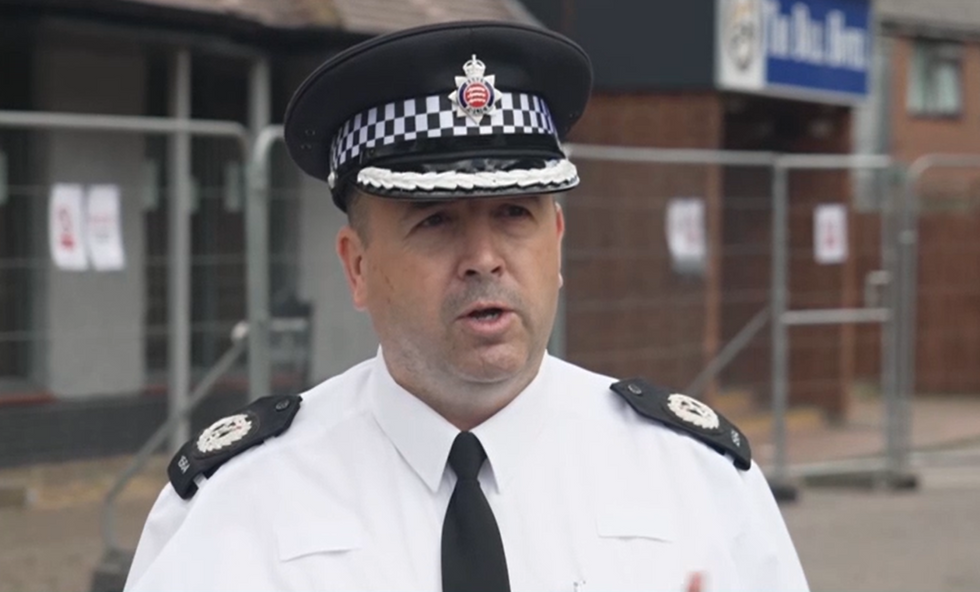 \u200bAssistant chief constable Stuart Hooper holds a press conference