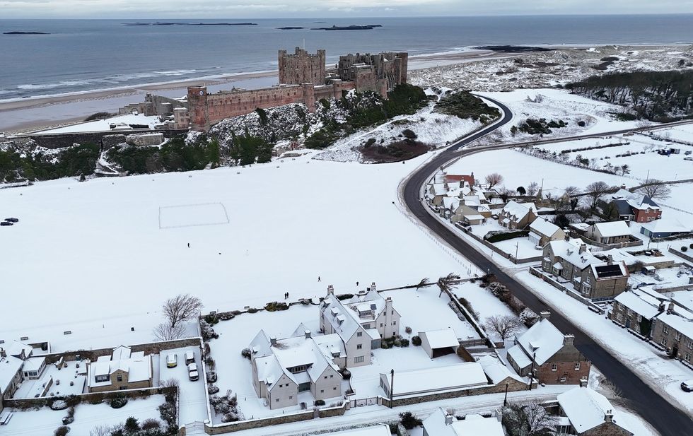 \u200bBamburgh Castle surrounded by snow in Bamburgh