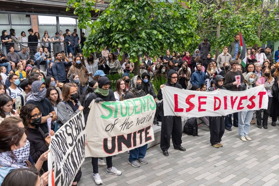 \u200bBanners were held outside the university