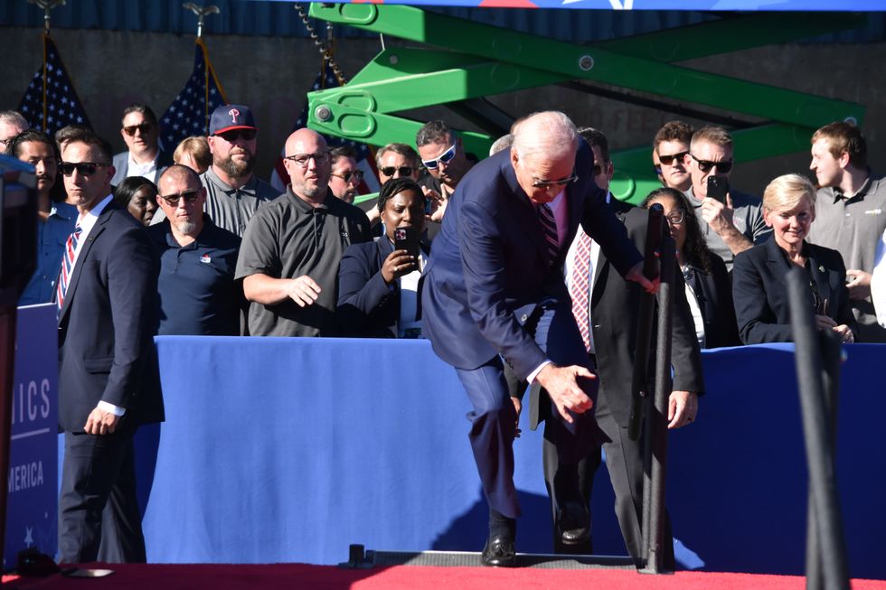 \u200bBiden stumbles climbing stairs