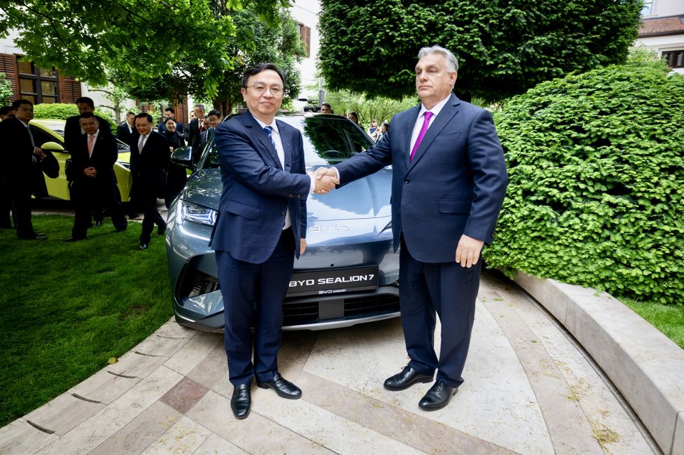 \u200bBYD Chairman Wang Chuanfu with Prime Minister of Hungary Viktor Orb\u00e1n in front of a BYD Sealion 7