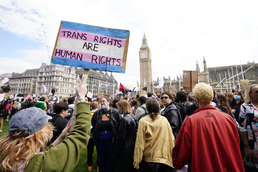 \u200bCampaigners take part in a rally organised by trans rights groups, trade unions, and community organisations at Parliament Square, central London