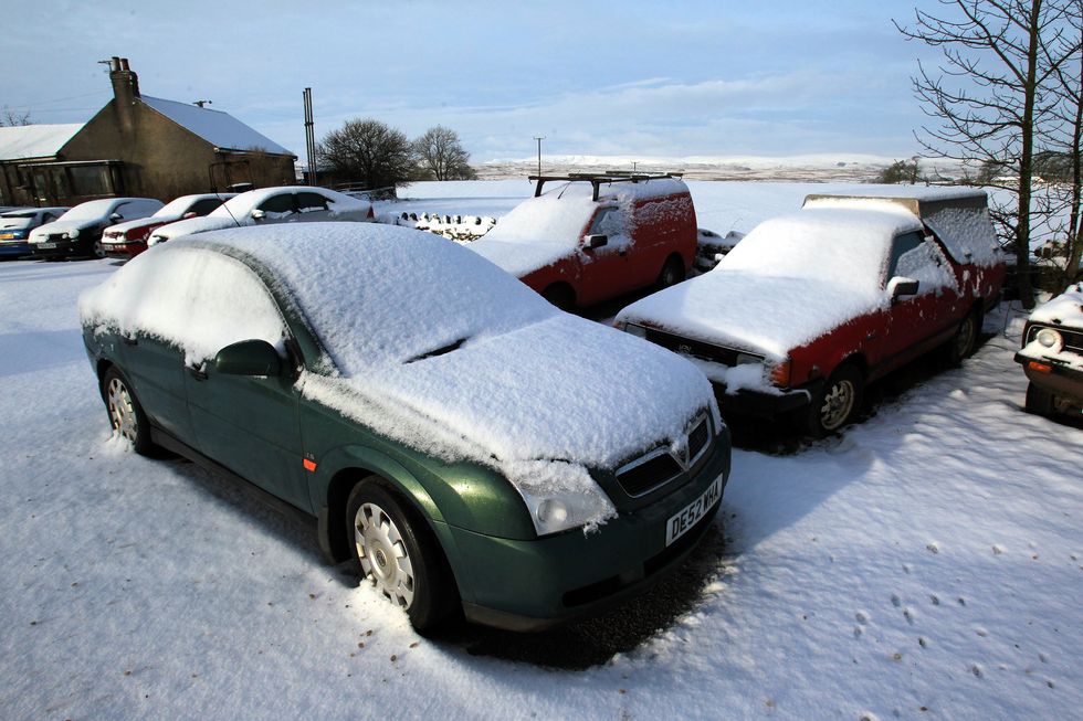 \u200bCars are seen covered in snow in Shap, Cumbria,