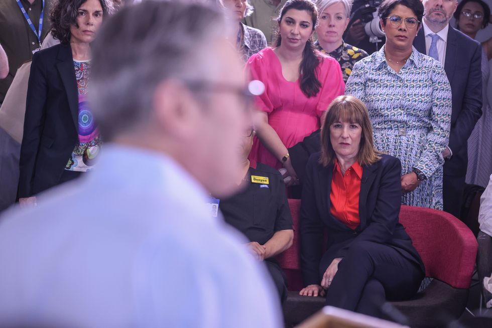 \u200bChancellor of the Exchequer Rachel Reeves listens to Prime Minister Sir Keir Starmer speaking