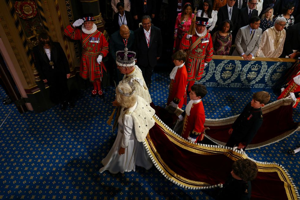 \u200bCharles, Camilla and the page boys walk up to the throne