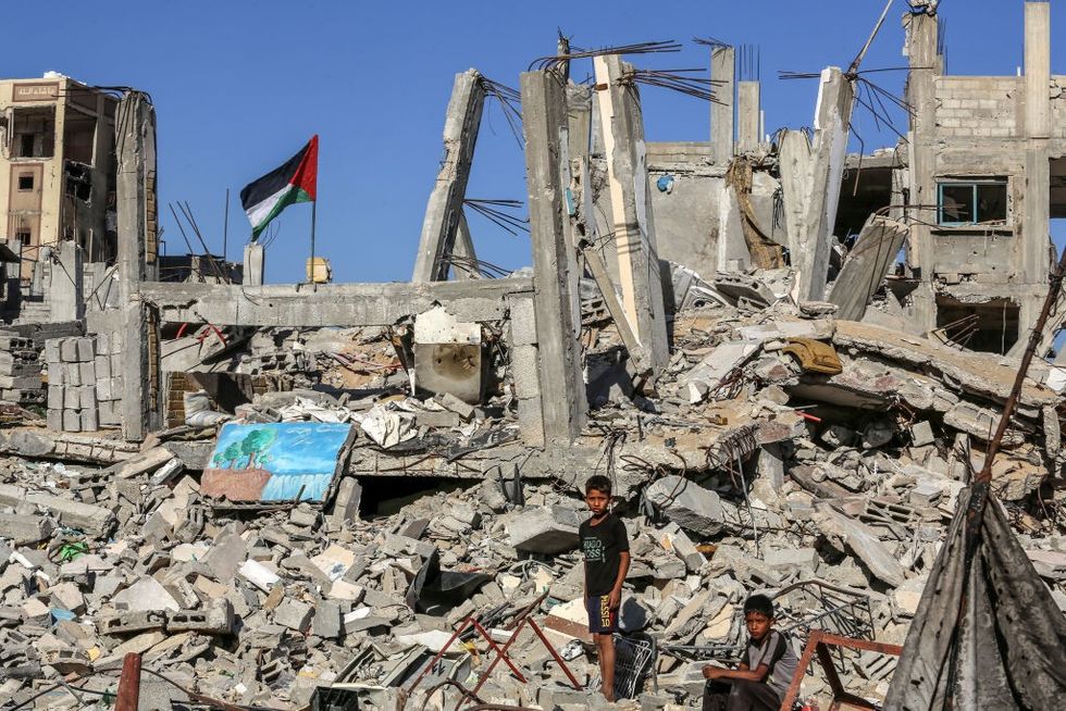 \u200bChildren are seen among the rubble as Palestinians try to survive amid the rubble of houses destroyed in the Israeli attacks
