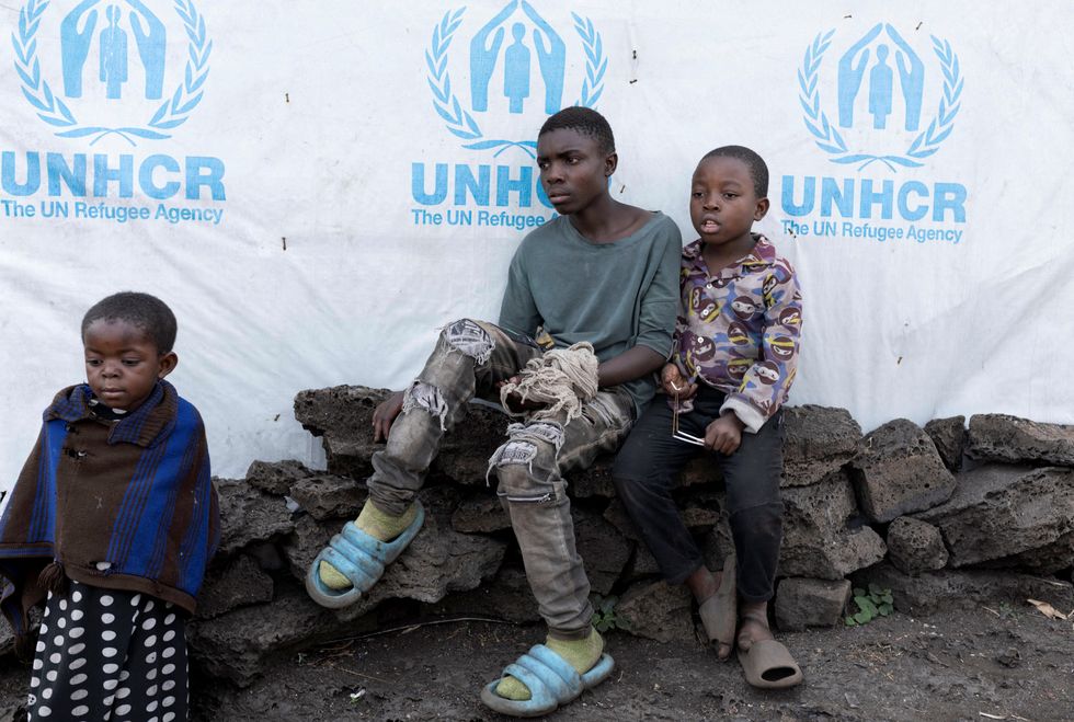 \u200bChristevie Lukeka,10, sits with Gedeon Kakule,13, both who recovered from Mpox